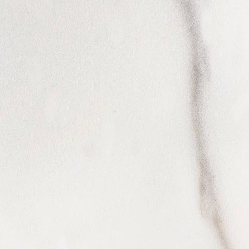 Bianco Ibiza marmorflise — cremet hvid baggrund med subtile beige og grå skygger